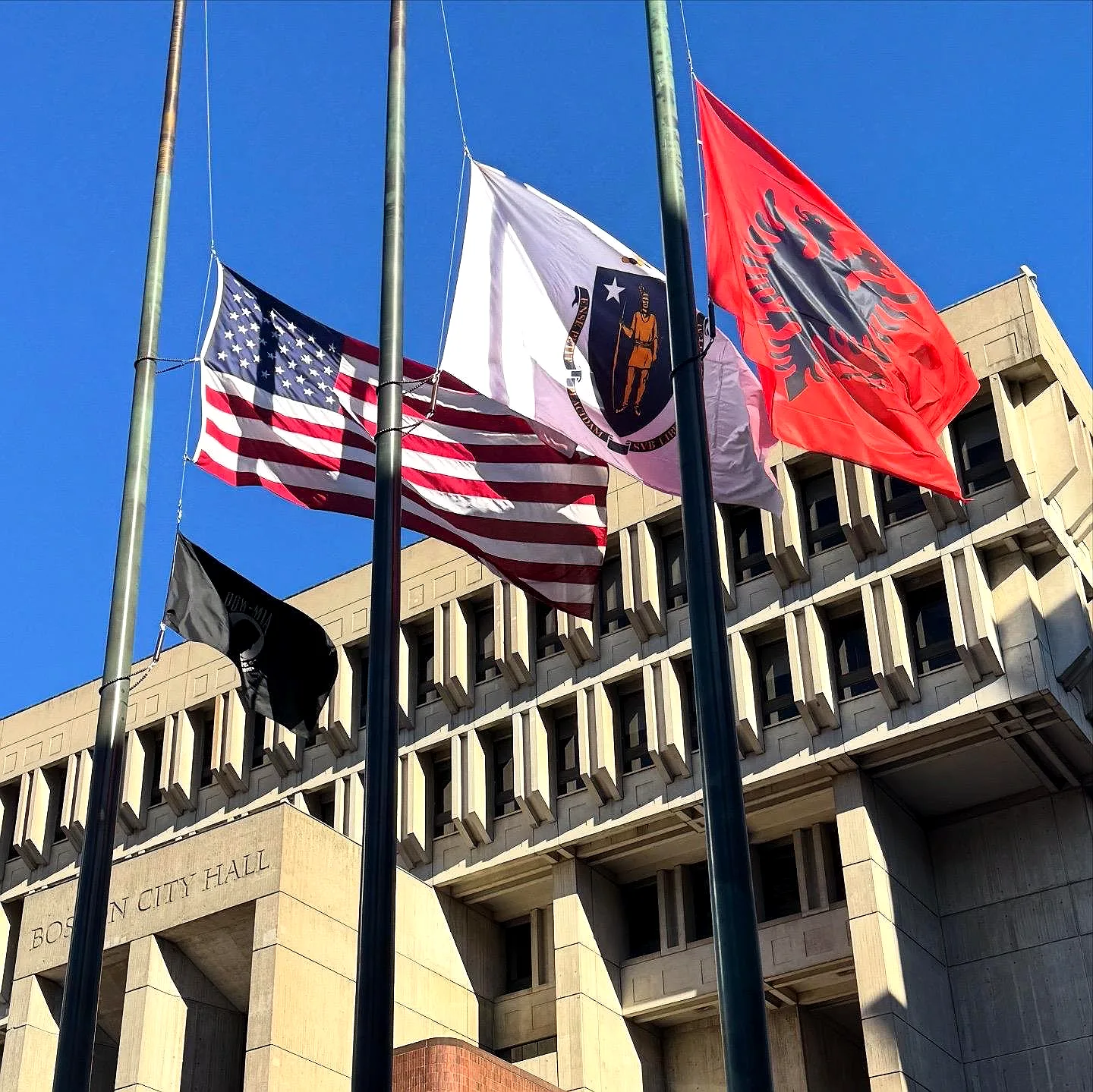 Albanian flag flying at Boston City Hall